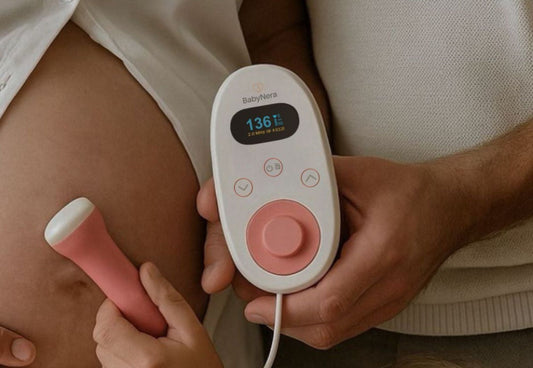 expecting parents sharing a moment listening to their baby’s heartbeat at home