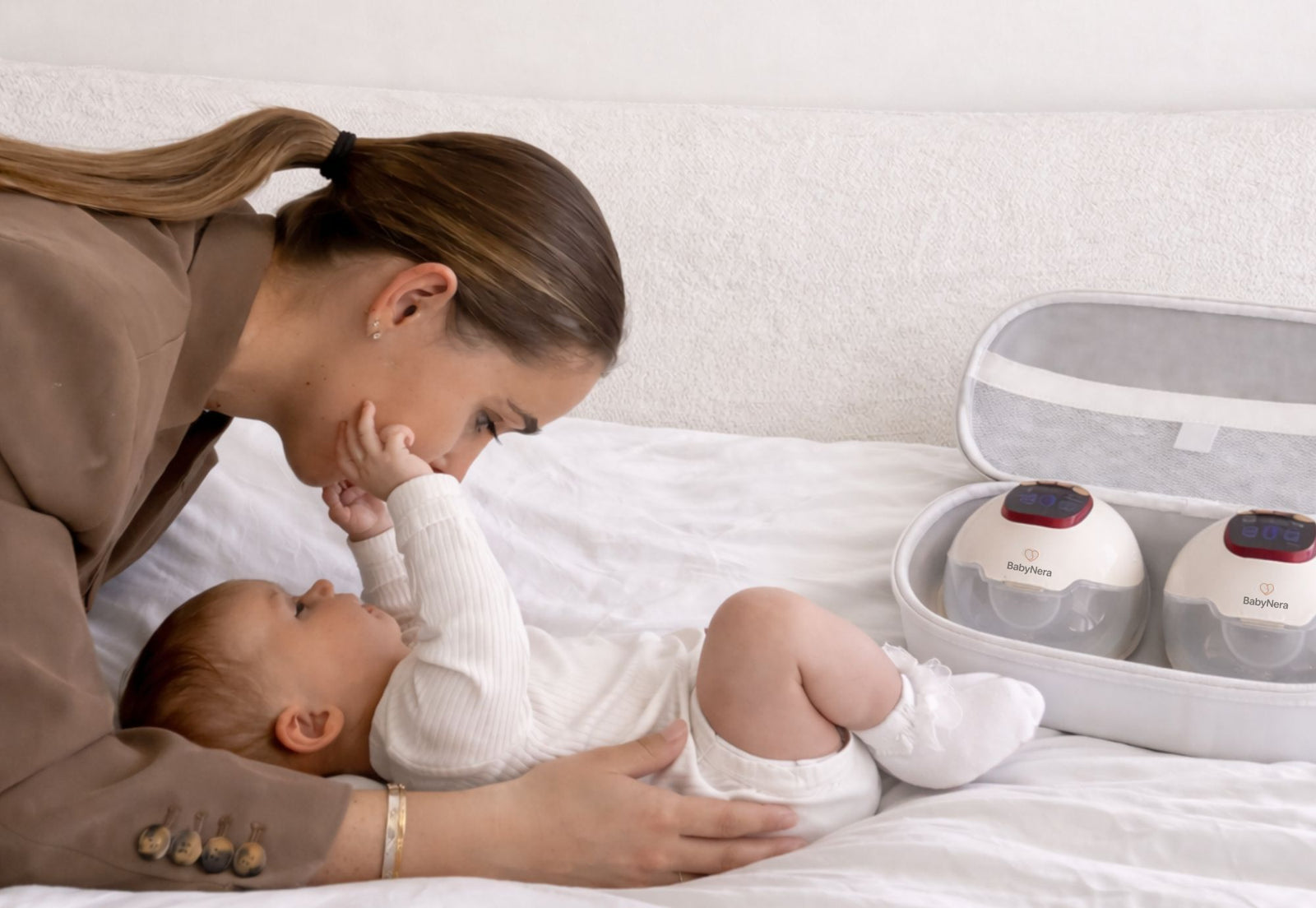 mother using wearable breast pump at home with baby, hands free pumping routine