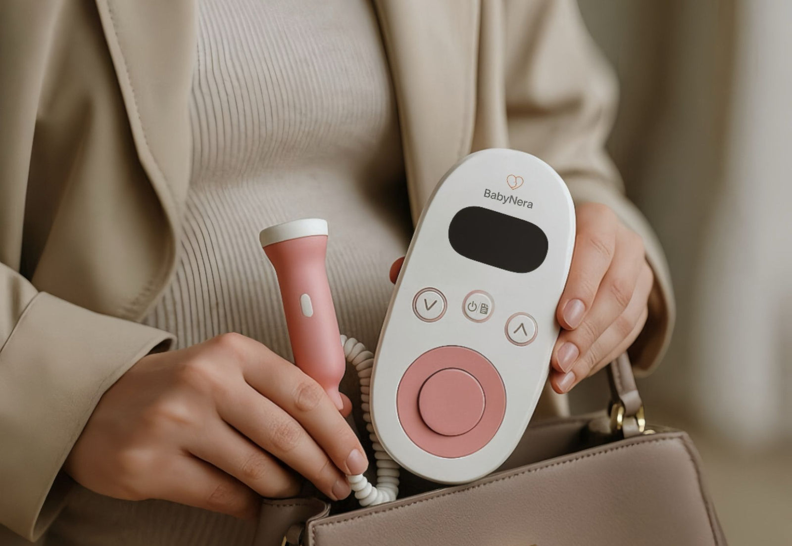 fetal doppler device held by pregnant woman at home for monitoring baby heartbeat