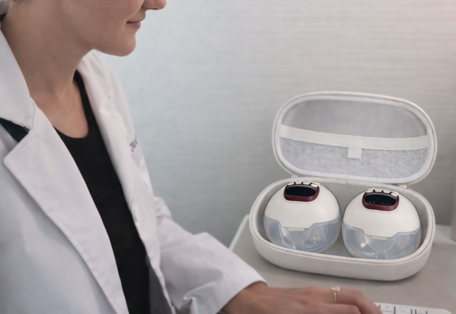 wearable breast pump in storage case for work or travel