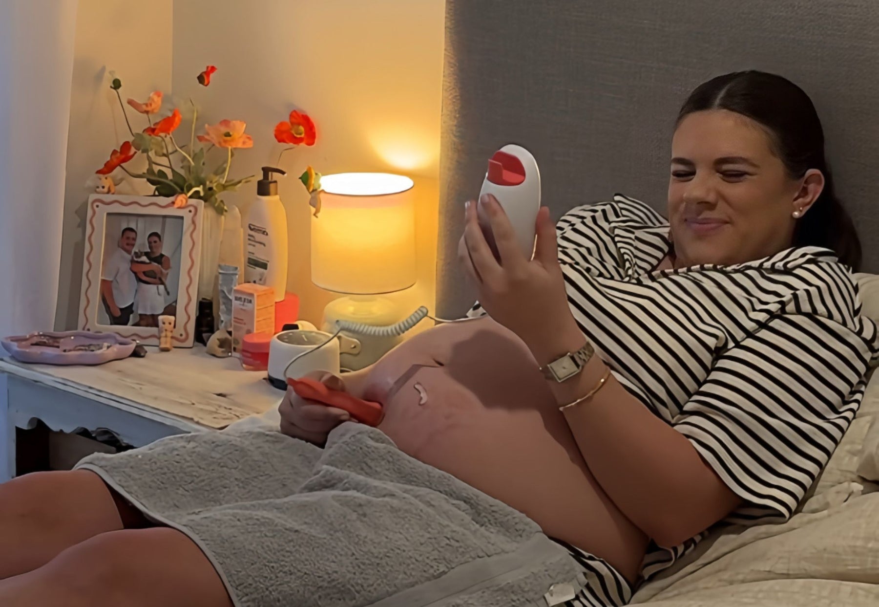 Expectant mother using the #1 choice for US parents at-home fetal doppler to hear baby heartbeat clearly.